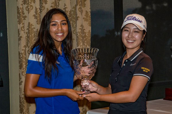 Stephanie Heimler (left) and Christina Park (last year's champion)  hoist the Mickey Wright Invitational for High School Girls Trophy